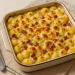 Gnocchi gratinati al forno con pancetta affumicata, porro e crescenza